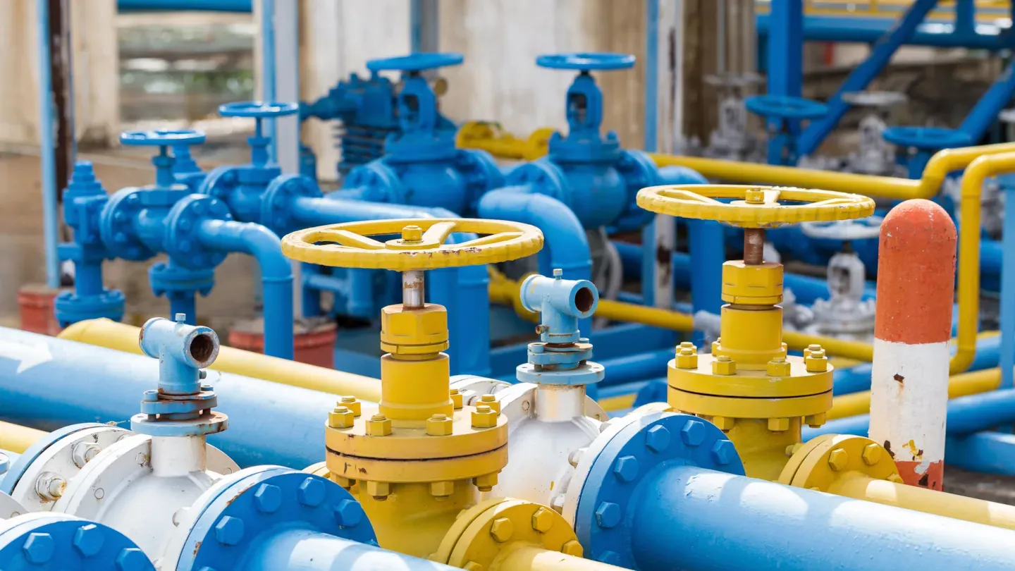 Industrial pipeline system with pressure valves and safety controls, illustrating pressure equipment certification and regulatory compliance