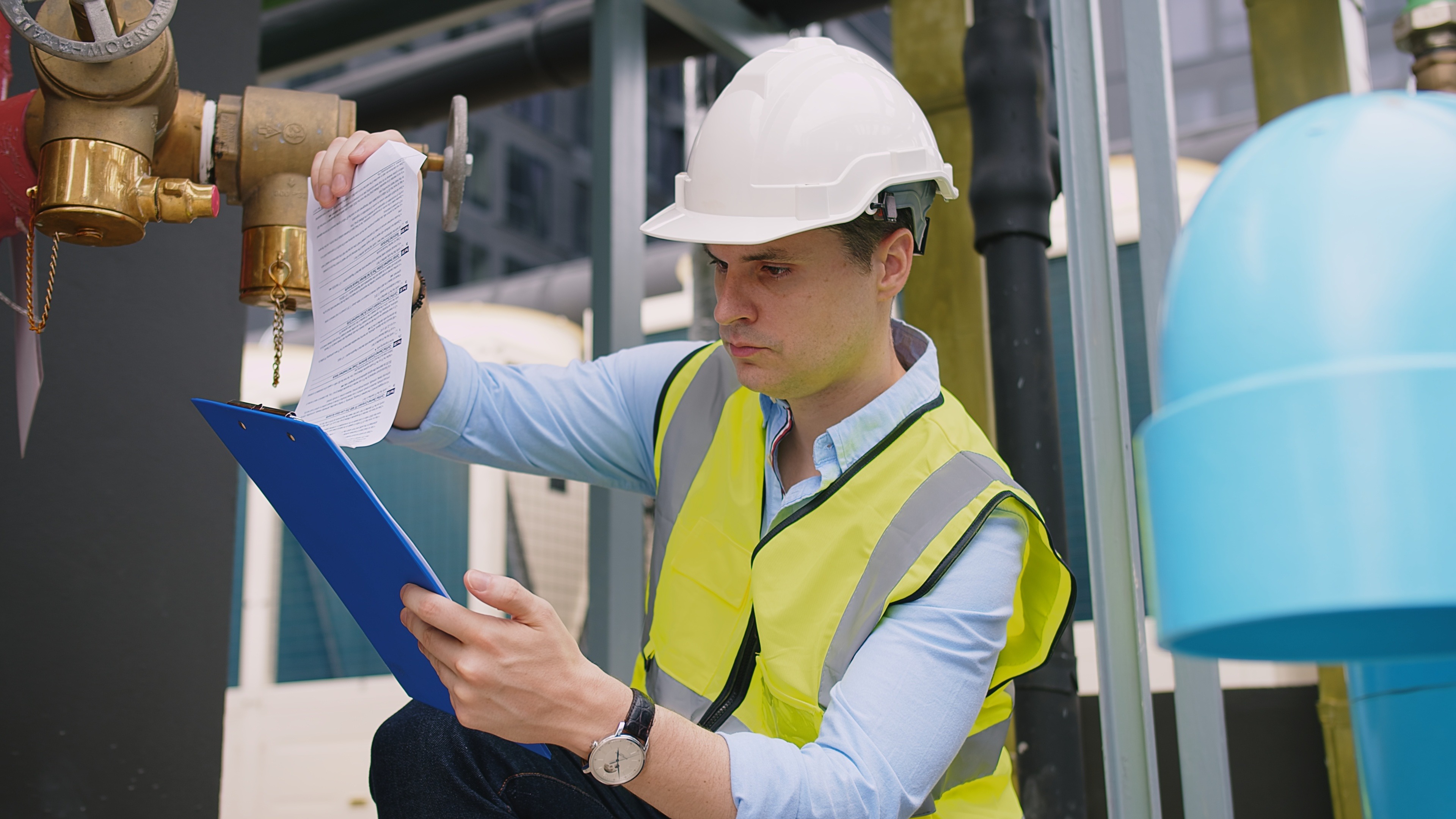 Engineer conducting inspection of pressure equipment in an industrial facility, representing ASME AIA compliance and third-party verification