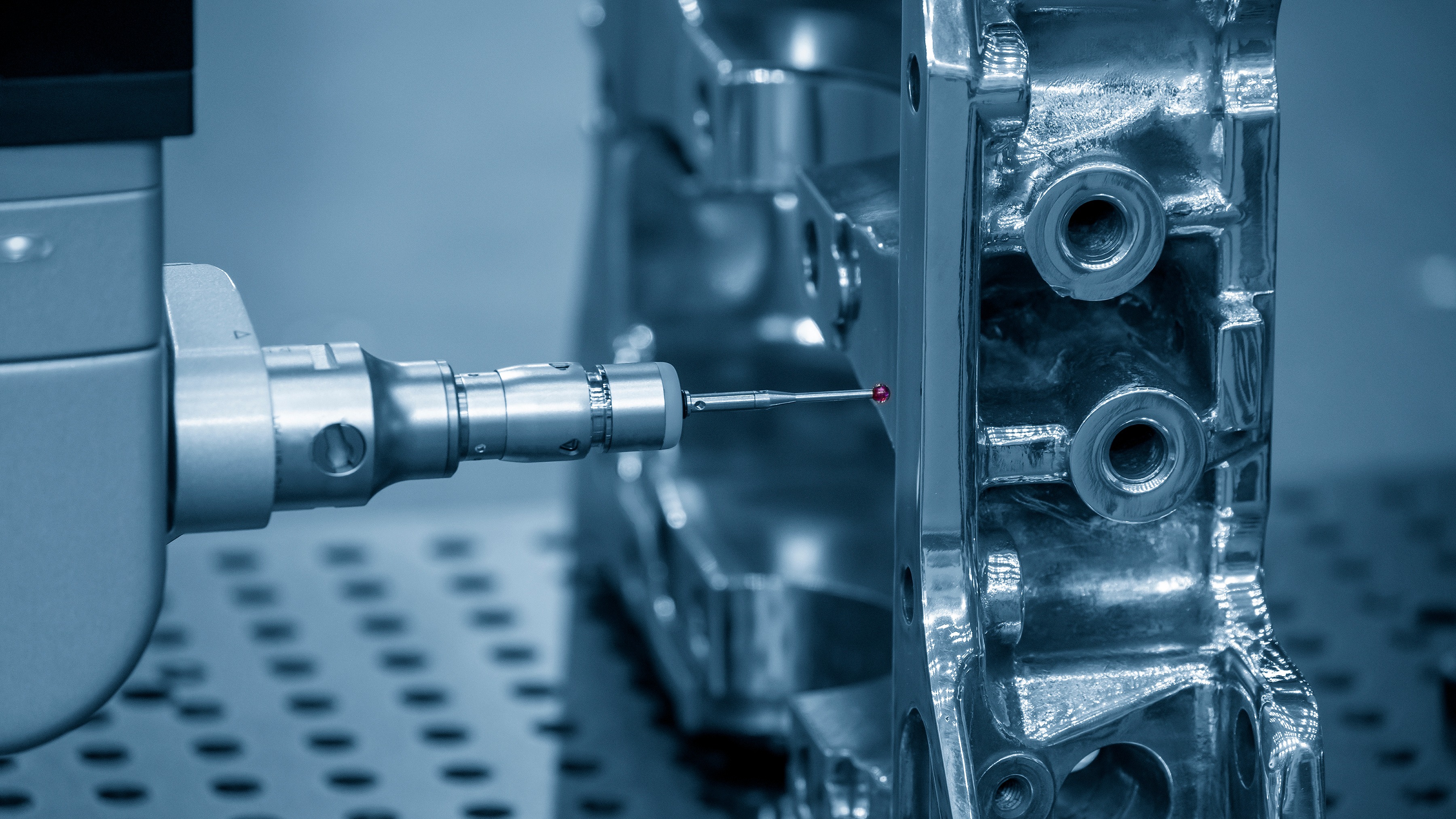 Technician using precision tooling on a metal construction component for conformity assessment