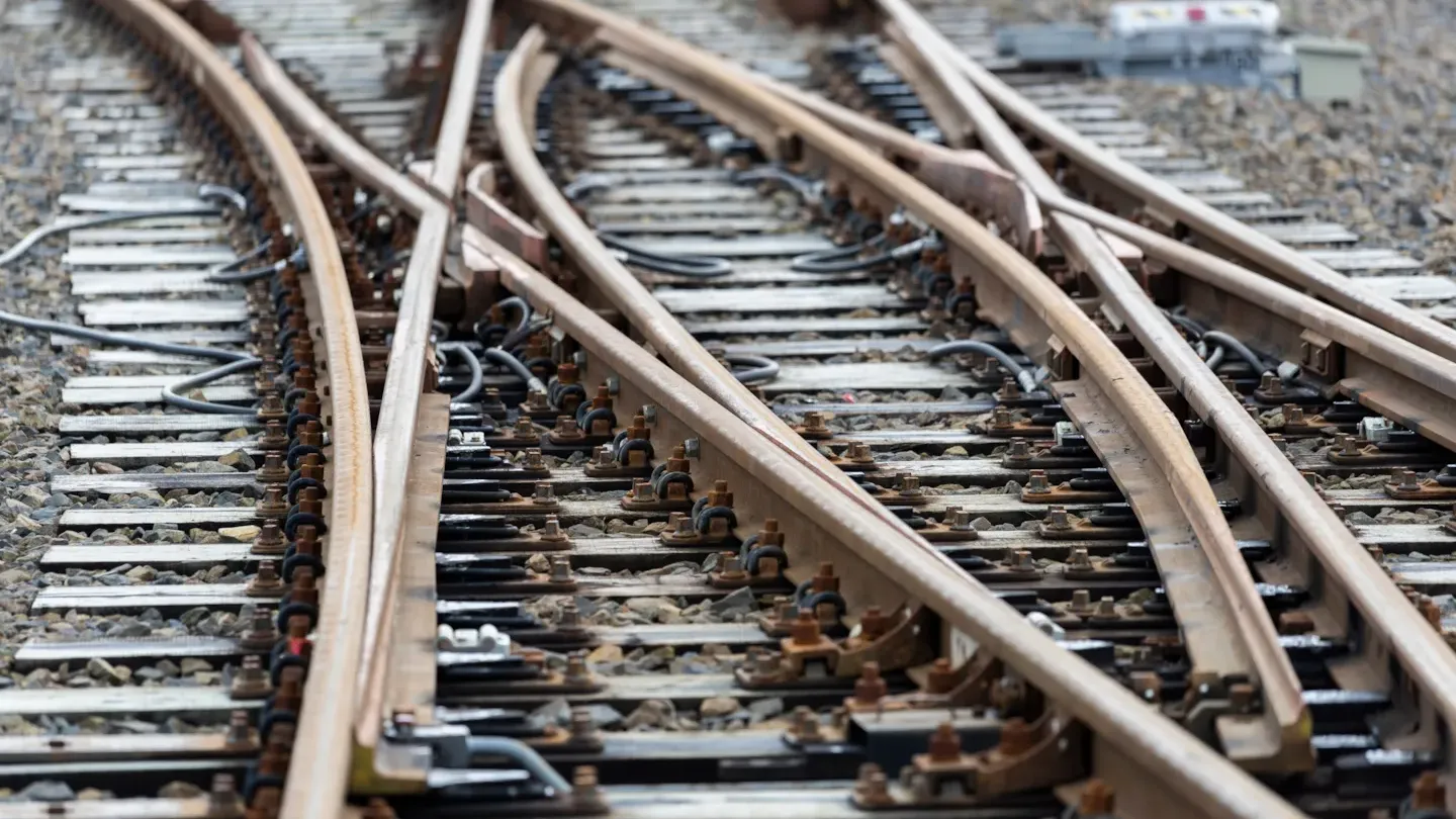 Close-up of railway track switches representing cybersecurity risks in critical rail infrastructure