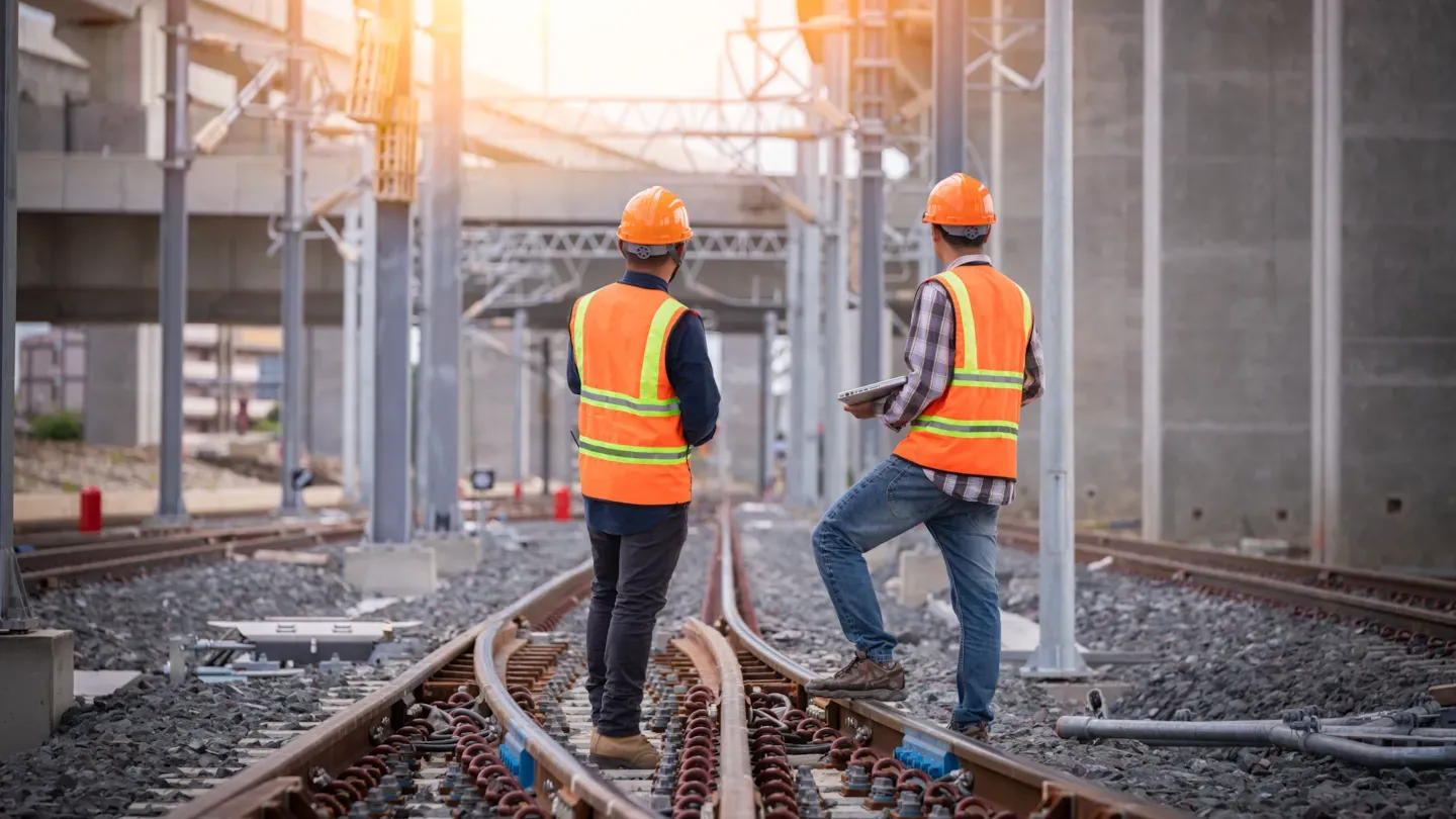 Railway engineers inspecting trackside infrastructure as part of rail supply chain cybersecurity assurance and vendor risk management