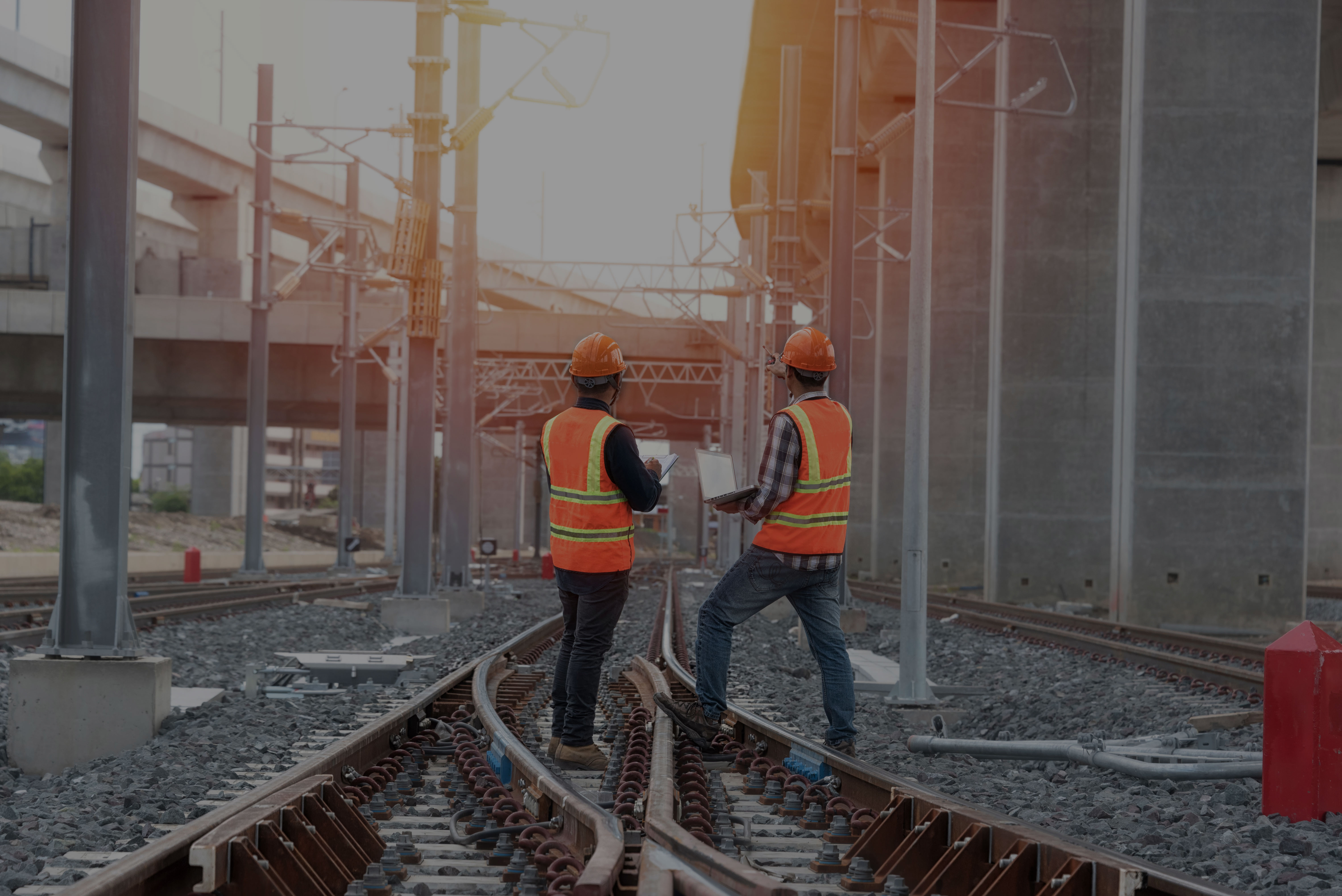Railway engineers inspecting track infrastructure representing DNV’s railway assurance and certification services.