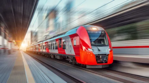 High-speed metro train moving through a modern railway system, representing rail performance optimization and safety improvements