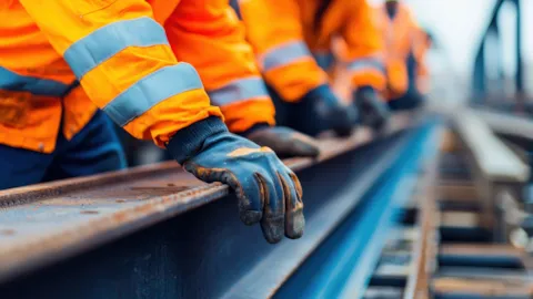 Rail project engineer inspecting track during construction to ensure safe, compliant delivery.
