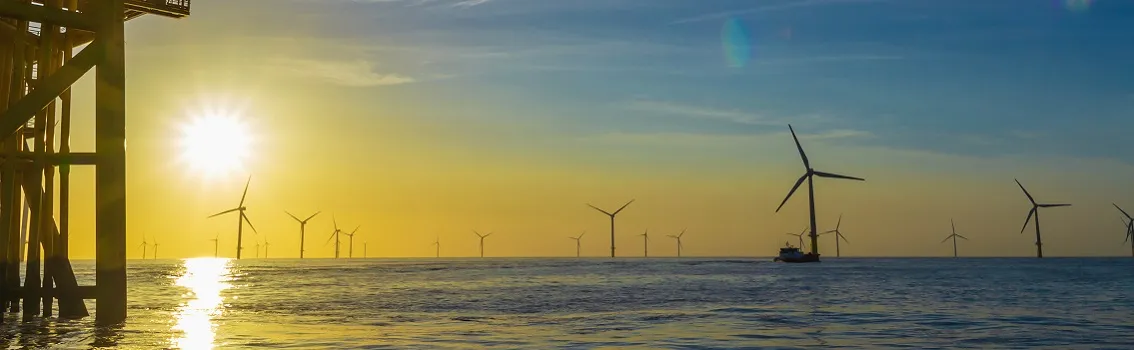 sunset over the North Sea offshore wind farm