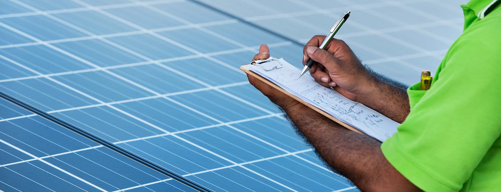 electric grid worker and solar panels