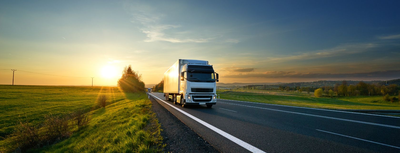 White truck driving on the road