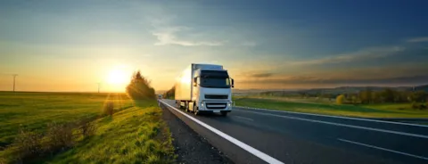 White truck driving on the road